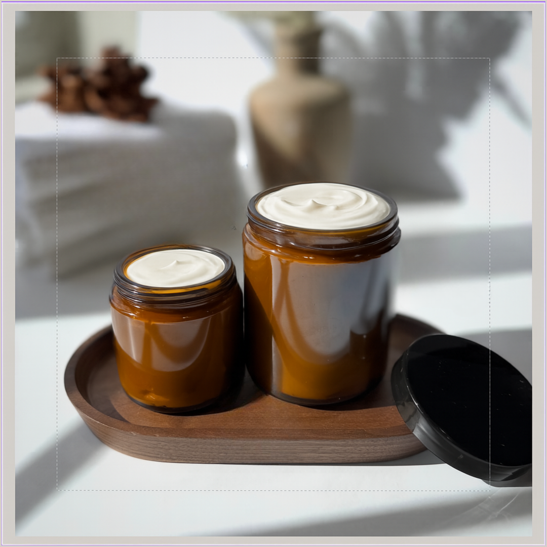 Two jars with a white substance on a wooden tray in a softly lit room.