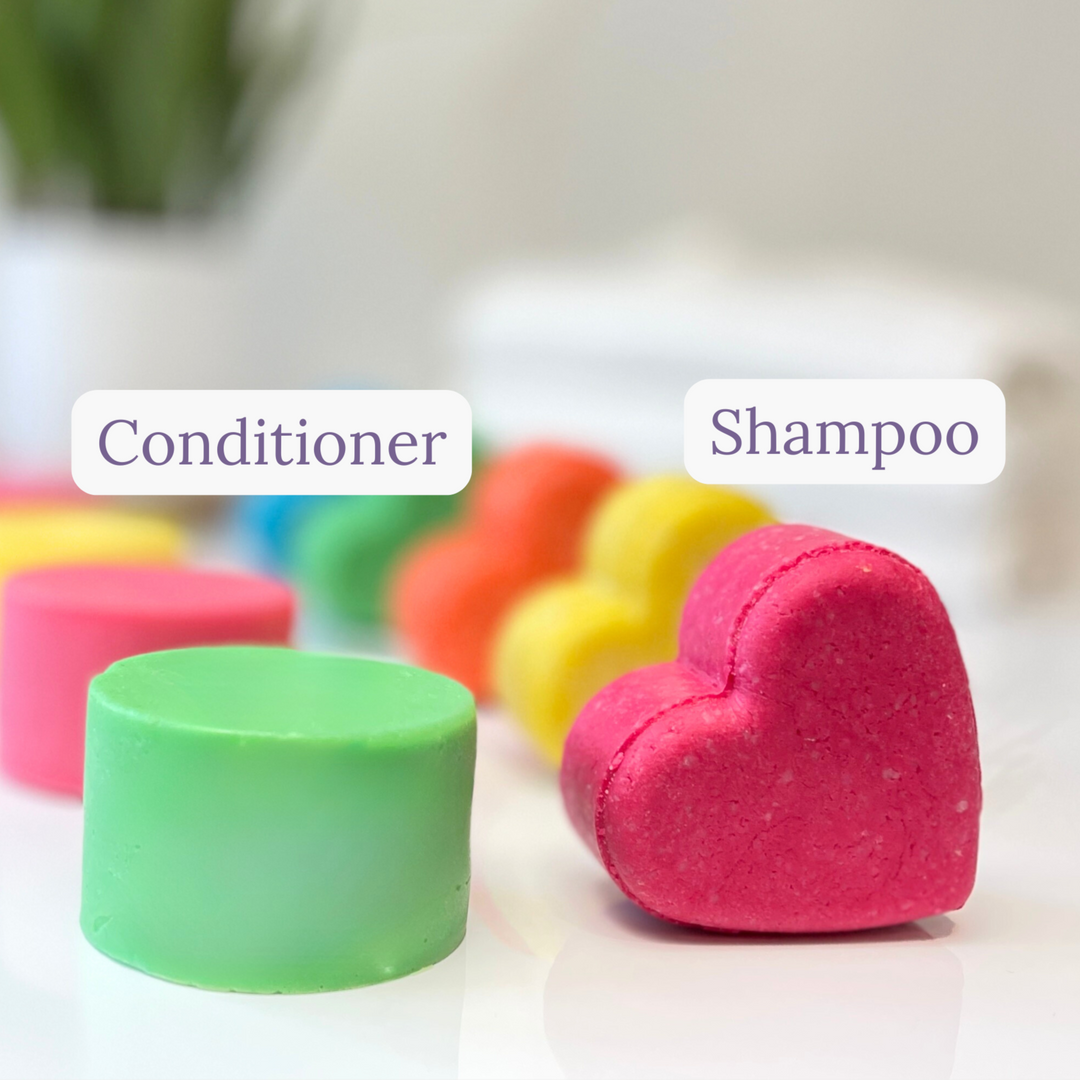 Colorful shampoo and conditioner bars on a white surface with blurred background